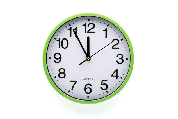 istock Wall clock on white background. Clipping path included. Five minutes to twelve. 1283414747