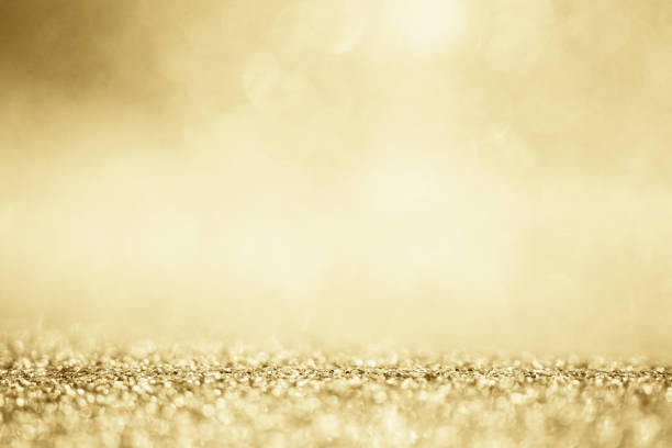 istock Abstract gold glitter sparkle blurred with bokeh background 1283415173