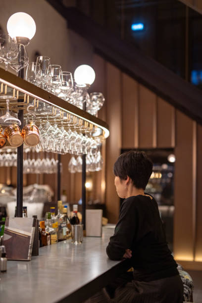 istock Japanese woman relaxing at bar after work 1283415187