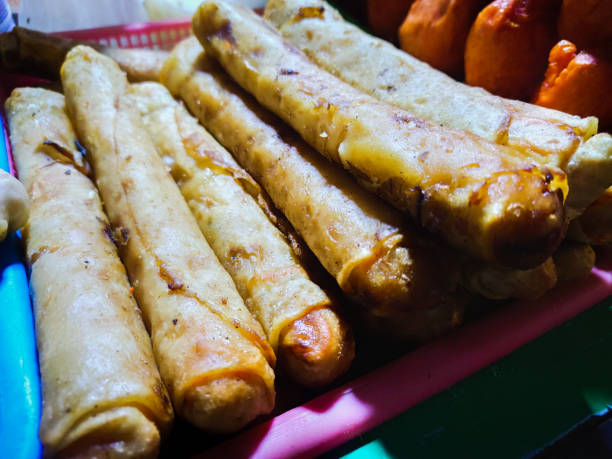 istock Spring rolls uncooked in plate ready to deep fry at shop 1283416325