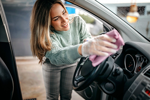 Women cleaning car interior