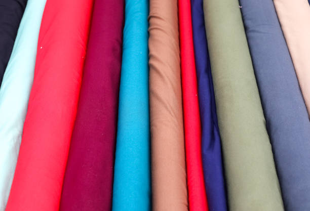 istock Detailed close up view on samples of cloth and fabrics in different colors found at a fabrics market 1283420666