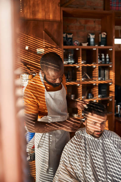 istock Handsome male client getting haircut in barbershop 1283421587