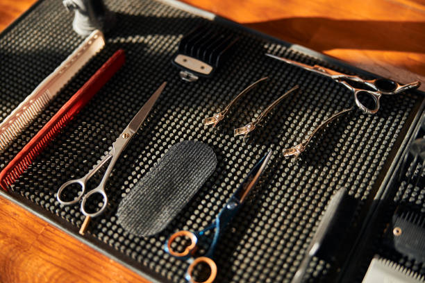 istock Hairdressing tools on barber rubber mat in barbershop 1283421624