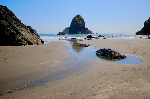 Sunny day with late fog lingering out to sea on Whaleshead Beach in Oregon's Samuel H. Boardman State Scenic Corridor