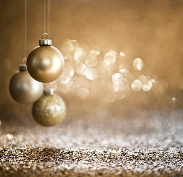 Christmas Gold Baubles on Gold Background Very Shallow Depth.