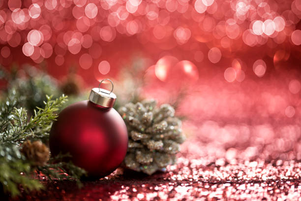 istock Christmas Red Baubles on a Red Background 1283428867