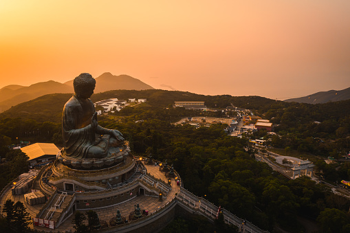 Drone view of The Big Buddha is lit in the evening