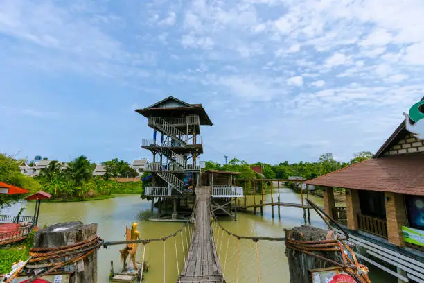 Photo of The tower is located in the middle of the water made of wood in Chon Buri Province in Thailand.