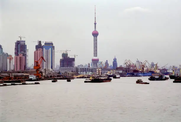 Shanghai, China - Oct 13, 1996: The Oriental Pearl Radio & Television Tower was completed in 1995. In 1996, there were few skyscrapers in the area, but now it is full of skyscrapers.