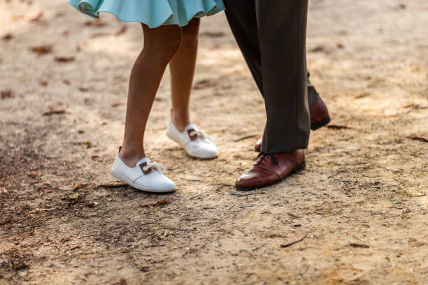 istock Charleston Dancers's legs in a park 1283432342