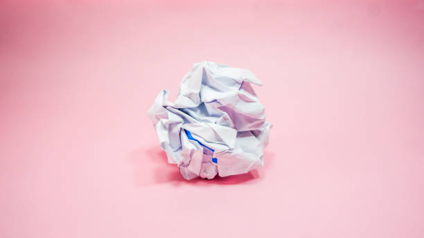 istock Crumpled paper in pink background 1283437130