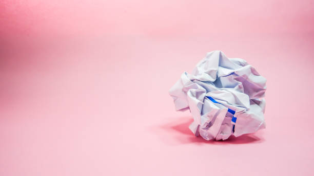 istock Crumpled paper in pink background 1283437158