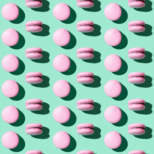 istock Seamless regular creative pattern of colorful french cookies macarons. Printing on fabric, wrapping paper. 1283445144