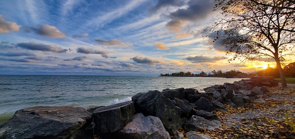 Stunning shot of Lake Erie with an autumn landscape and sunset.