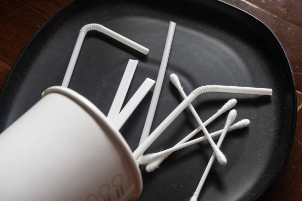 istock Single-use items concept. Coffee cup, straws, stirrers and cotton buds. 1283449093