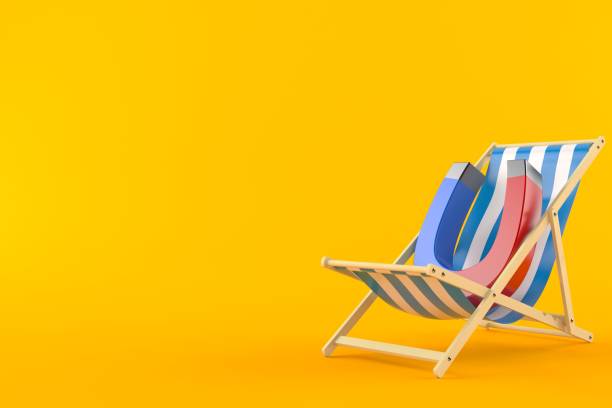 istock Horseshoe magnet on deck chair 1283449208