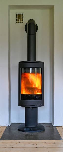 istock cast iron stove standing tall in livingroom 1283449450
