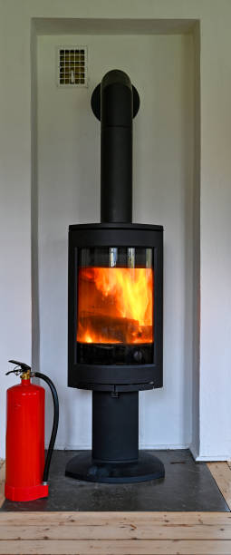 istock red fire extinguisher standing infront of a fireplace in livingroom 1283449451