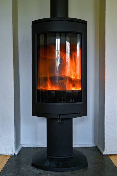 istock cast iron stove standing tall in livingroom 1283449452