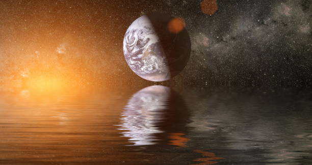 istock Beautiful unusual space planet in space reflected in water. Our beautiful Earth in reflection of water overlooking space ,galaxy stars night sky ,Elements of this Image Furnished by NASA , 1283451149