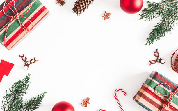 istock Christmas composition. Christmas gifts, fir tree branches, decorations on white background. Flat lay, top view, copy space 1283451156