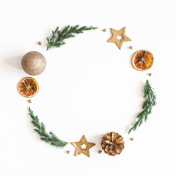 istock Christmas composition. Wreath made of fir tree branches, golden decorations on white background. Christmas, winter, new year concept. Flat lay, top view 1283451162