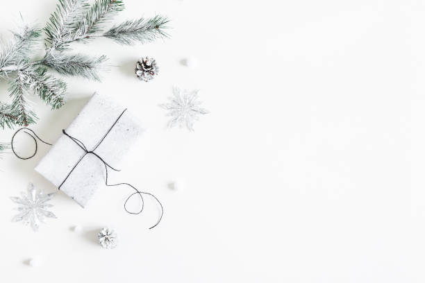 istock Christmas composition. Gift box, fir tree branches, decorations on white background. Christmas, winter, new year concept. Flat lay, top view, copy space 1283451218