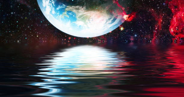 istock Beautiful unusual space planet in space reflected in water, galaxy stars night sky ,Elements of this Image Furnished by NASA , 1283451250