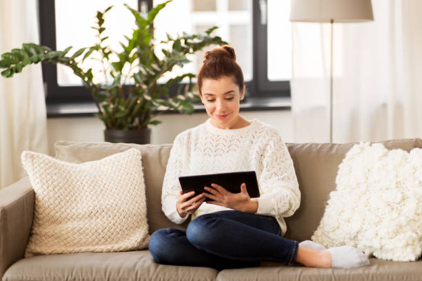 istock woman with tablet pc computer at home 1283451330