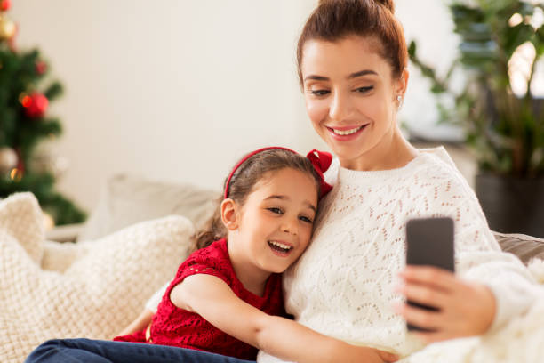 istock family taking selfie by smartphone at home 1283451433
