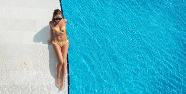 istock Woman relaxing in swimming pool 1283452057