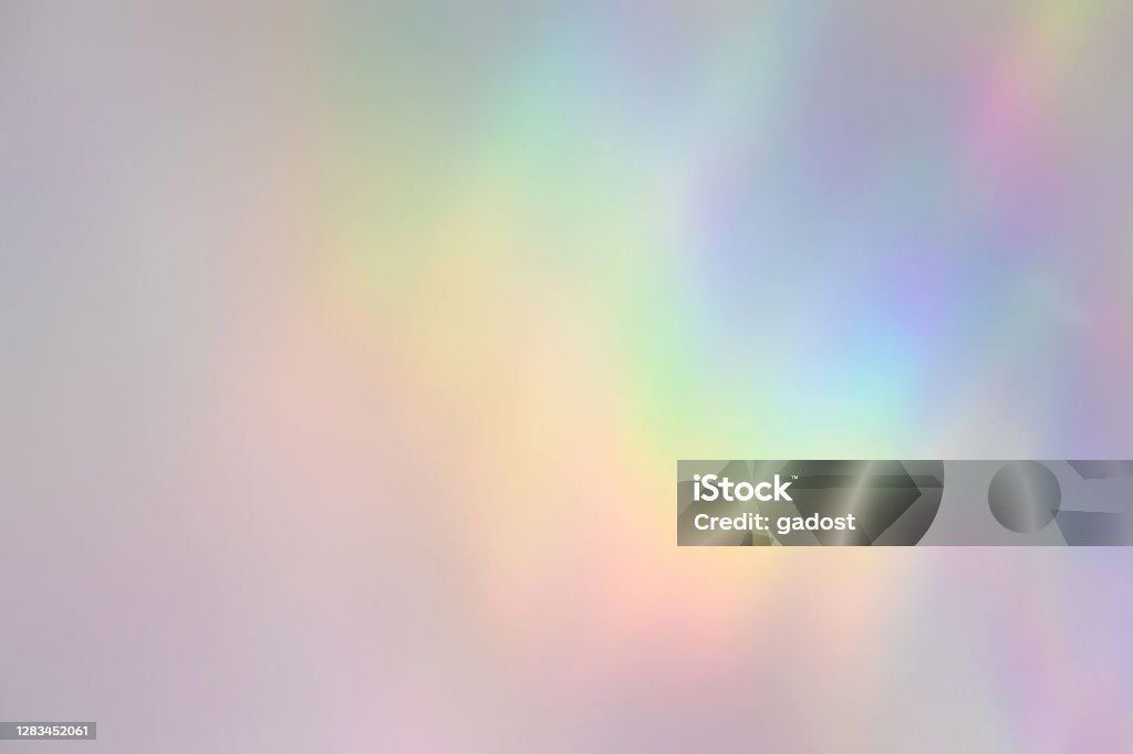 Blurred rainbow light refraction texture on white wall Blurred rainbow light refraction texture overlay effect for photo and mockups. Organic drop diagonal holographic flare on a white wall. Shadows for natural light effects Rainbow Stock Photo