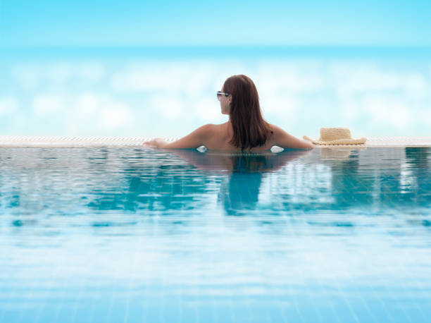 istock Woman relaxing in swimming pool 1283452109