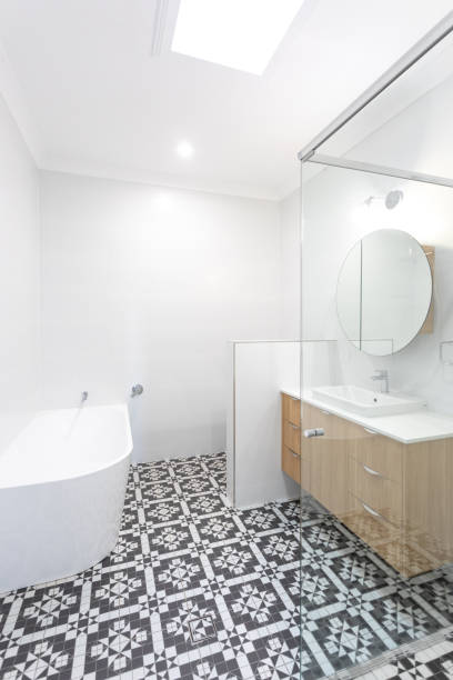 istock Stylish Renovated Bathroom With Tiled Floor 1283452268