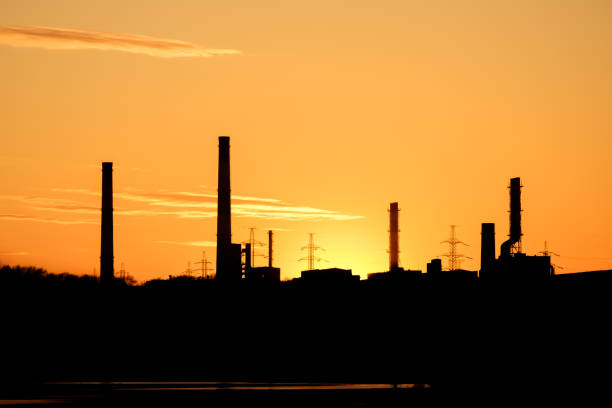 istock industrial landscape at sunset time, stopped factory 1283453443