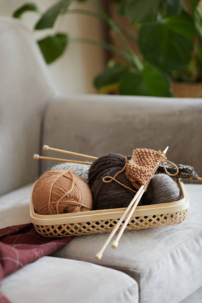 istock Balls of wool on the sofa 1283454325