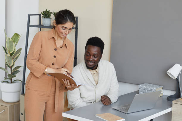 istock Business colleagues working at office 1283454490