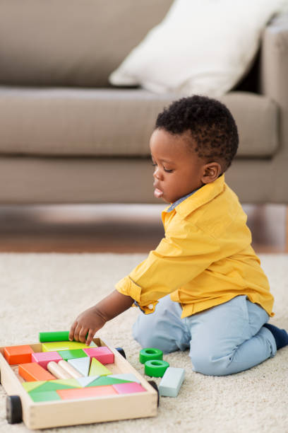 istock african american baby boy playing with toy blocks 1283454809
