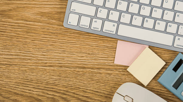 istock The keyboard  and office equipment on wood table for life style content. 1283457299