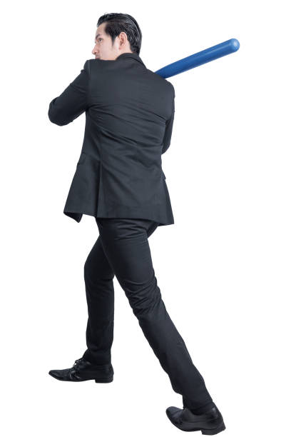 istock Asian businessman holding a baseball bat 1283457431