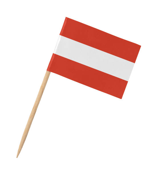 istock Small paper Austrian flag on wooden stick, isolated on white 1283457565