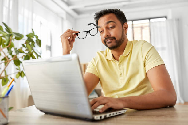 istock stressed man with laptop working at home office 1283461255