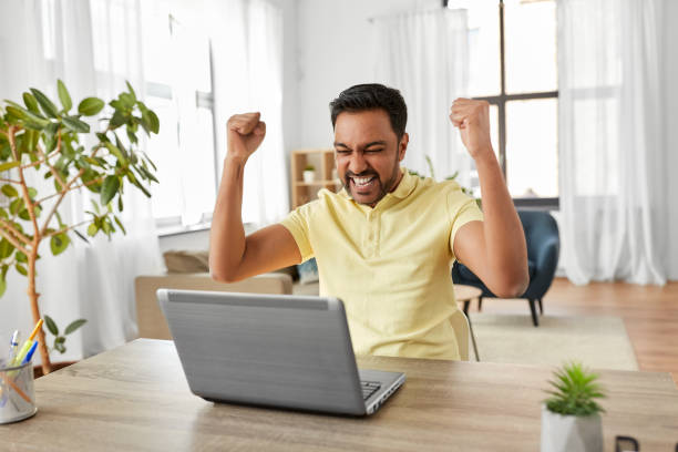 istock indian man with laptop working at home office 1283461272