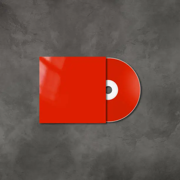 Red CD - DVD label and cover mockup template isolated on concrete background