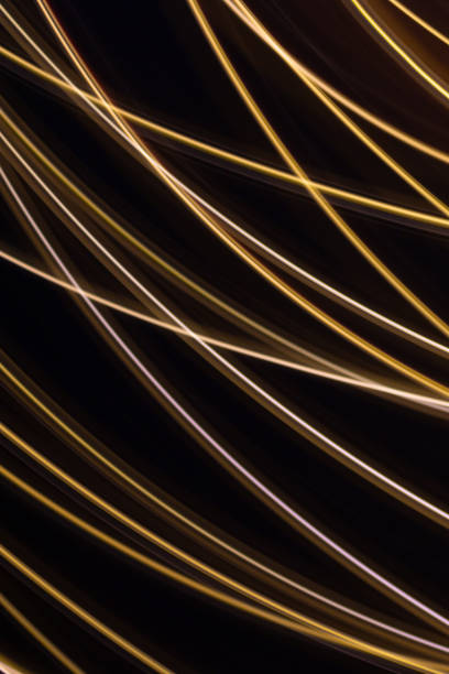 istock Festive black background with blurred gold lines. 1283462633