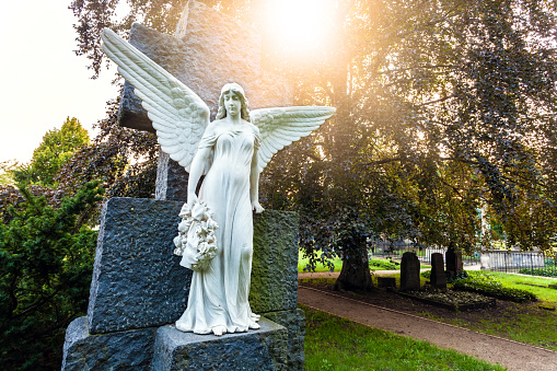 Cemetery angel with sun