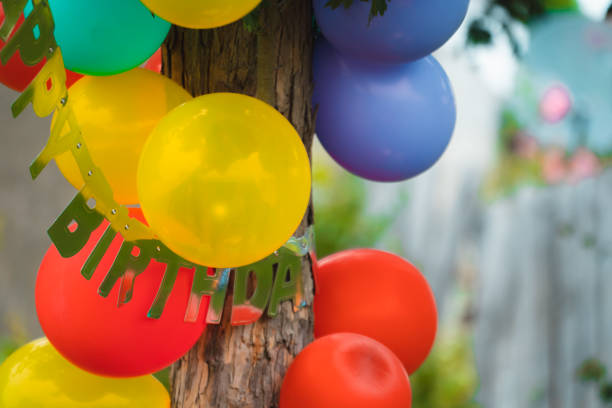 istock Party balloons attached to a pine tree 1283465474