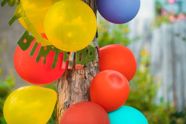 istock Party balloons attached to a pine tree 1283465552