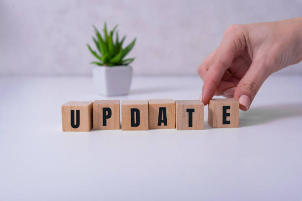 istock Update message sign on a wooden desk in a room 1283469804